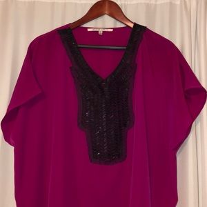 Pink polyester shirt with black beading
